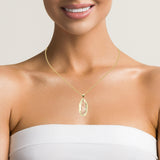 Catholic gold medallion pendant by Solomon Jeweler