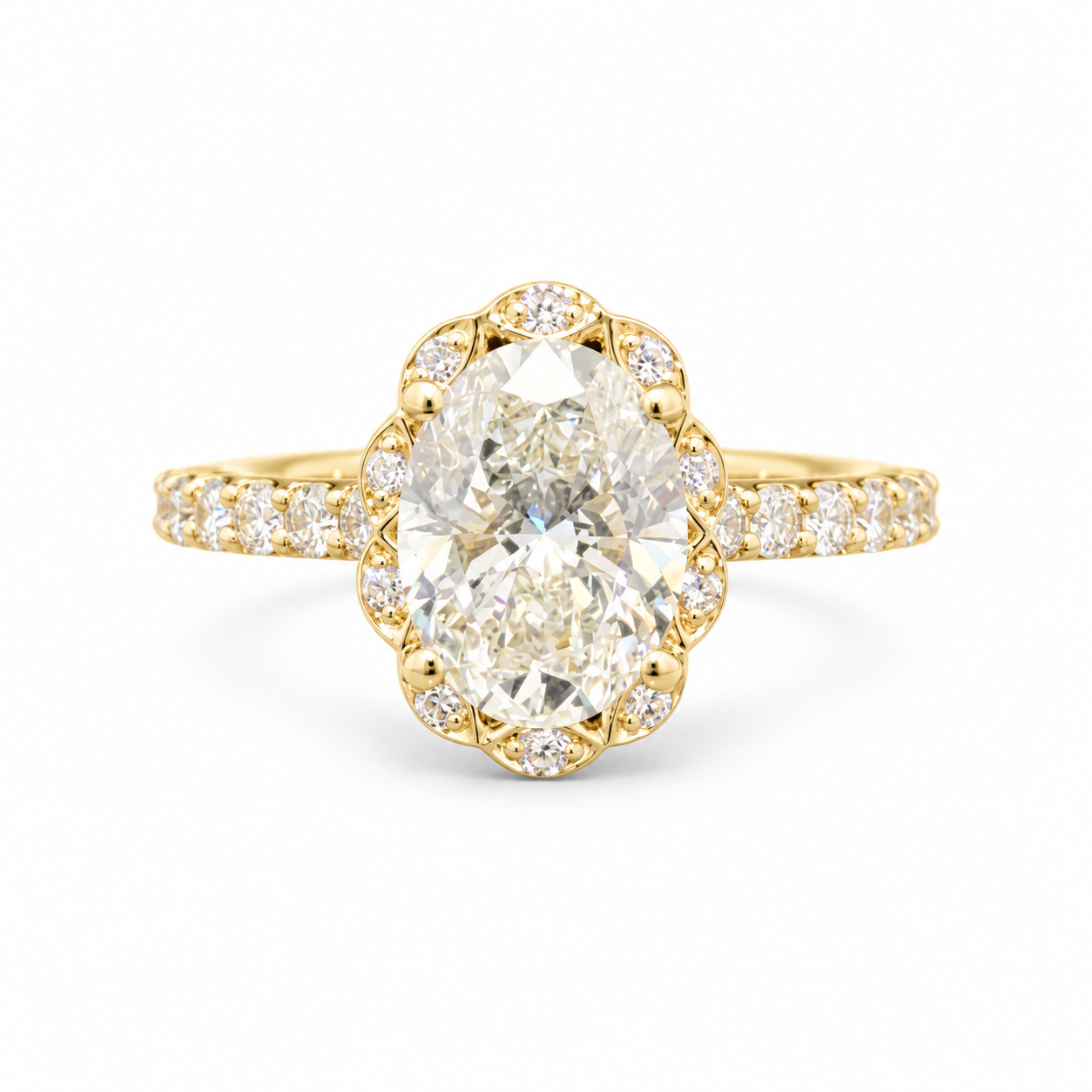A yellow gold ring featuring a large oval-cut diamond center stone surrounded by a decorative halo of smaller diamonds, with a slim diamond-set band, shown on a plain white background.