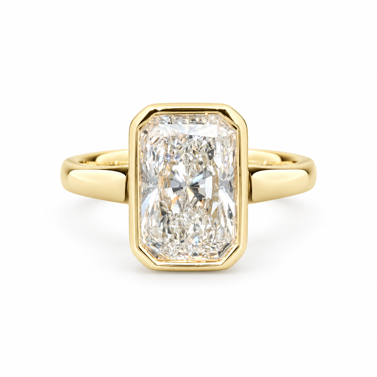A yellow gold ring featuring a large rectangular emerald-cut diamond. The diamond is clear and does not contribute to the color mapping according to the schema rules, so the product color is determined solely by the gold metal setting and band.