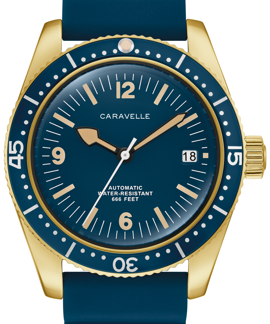 A Caravelle automatic dive watch with a gold-tone case, blue dial, and blue rubber strap, shown on a clean white background.