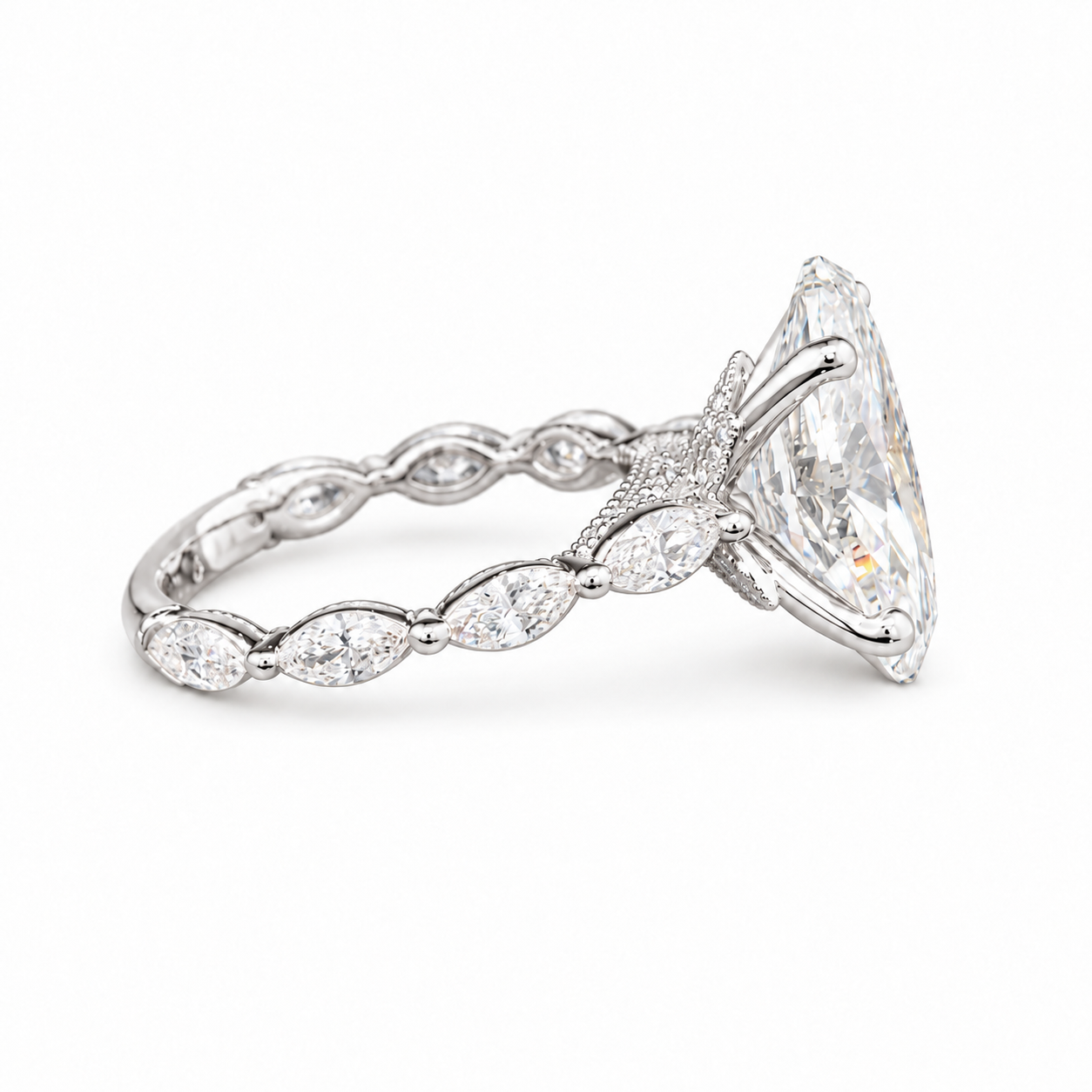 A silver-tone diamond ring featuring a large marquise-cut center stone and a band adorned with smaller marquise and oval diamonds.