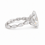A silver-tone diamond ring featuring a large marquise-cut center stone and a band adorned with smaller marquise and oval diamonds.