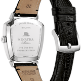 Bulova Sinatra Collection wristwatch shown from the back, featuring a polished silver-tone case, genuine leather strap, and a black textured leather strap on a white background.