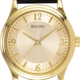 A Bulova wristwatch with a gold-tone case and dial, featuring a black textured leather strap, shown against a plain white background.