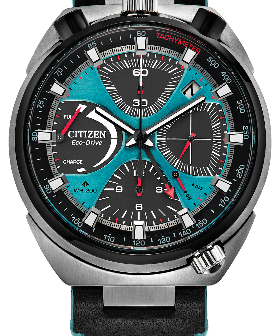 Citizen Eco-Drive chronograph watch with a black perforated leather strap, silver-toned stainless steel case, and a vibrant turquoise dial with black, white, and red details.