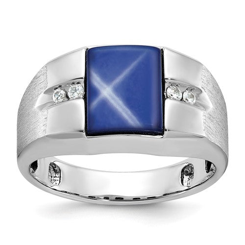 14k white gold ring featuring a satin finish, blue star sapphire center stone, and diamond accents, designed by Solomon Jewelers.
