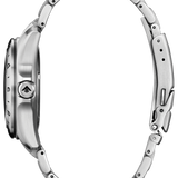 Close-up of a silver watch with a detailed band on a white background