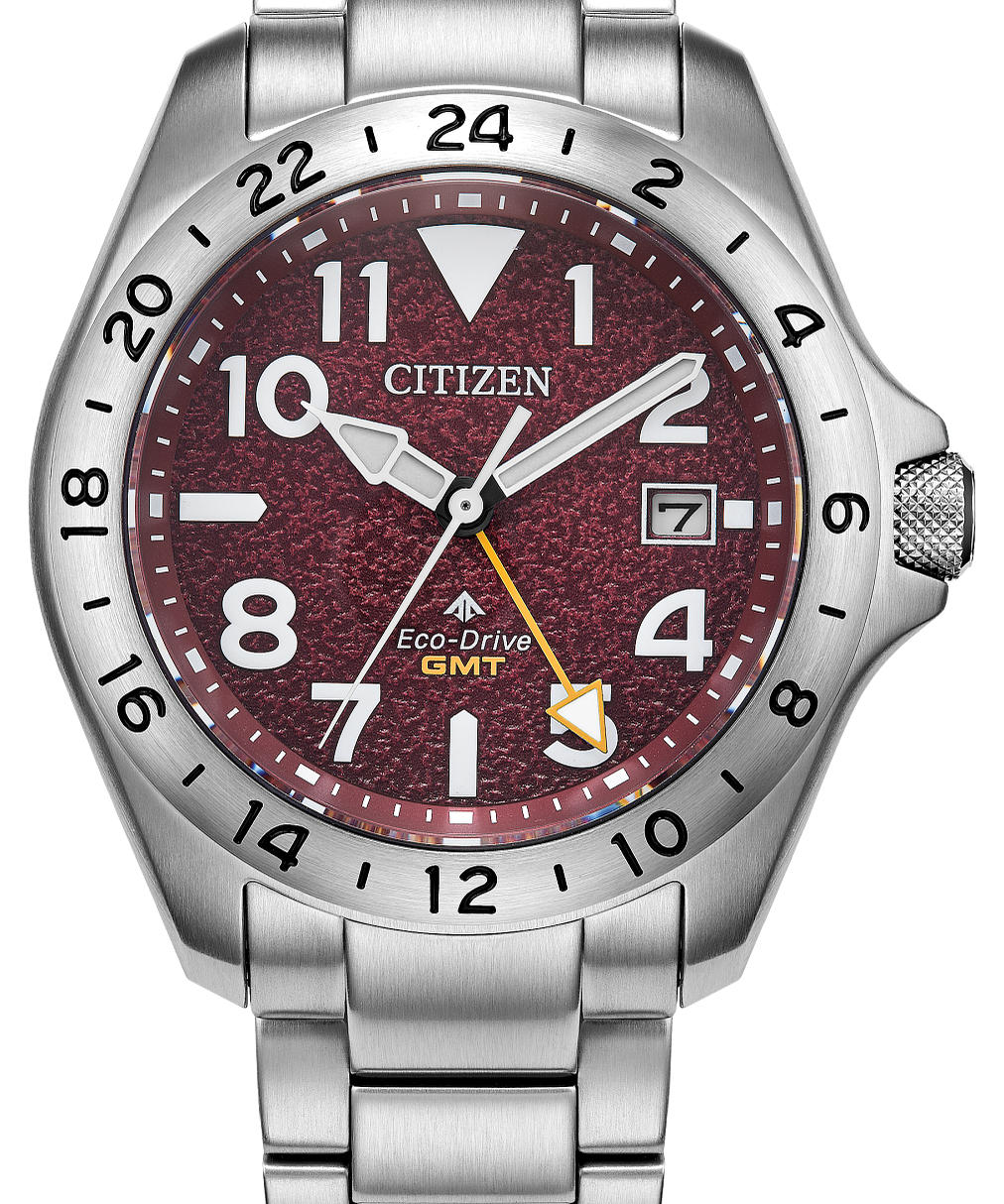 Silver Citizen watch with a red face on a white background