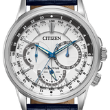 Citizen Eco-Drive World Time watch with a silver stainless steel case, white dial with blue hands and subdials, and a navy blue leather strap with white stitching.