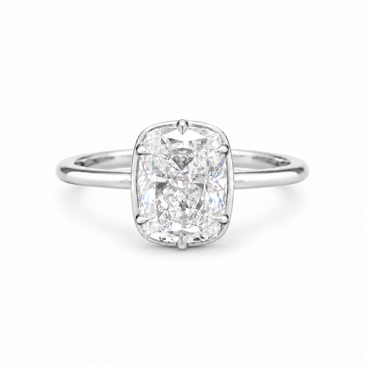 A radiant cut diamond engagement ring with a polished silver-colored band, centered on a clean white background.