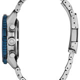 Close-up of a silver watch with a blue accent on a white background