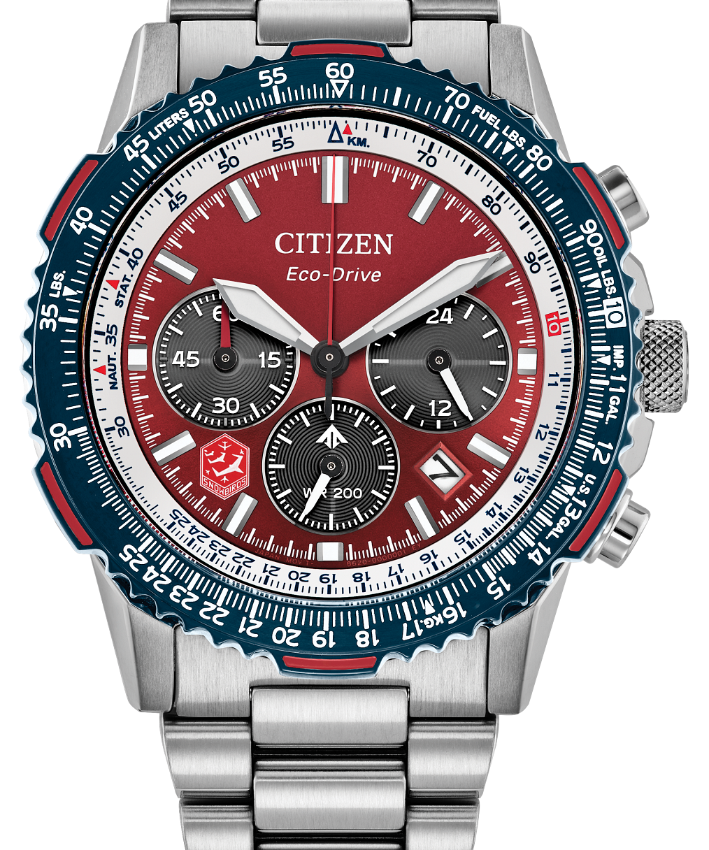 Citizen Eco-Drive chronograph watch with a silver stainless steel bracelet, featuring a red dial, a blue and white bezel, and three black subdials.