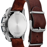 Citizen watch shown from the back, featuring a silver stainless steel case and a dark brown leather strap with silver metal hardware.