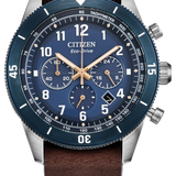 Citizen Eco-Drive watch with a blue dial, blue bezel, brown leather strap, and silver stainless steel case on a white background.