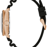 Side profile of a watch with a rose gold case, silver-toned bezel, and a thick black wavy rubber strap on a white background.
