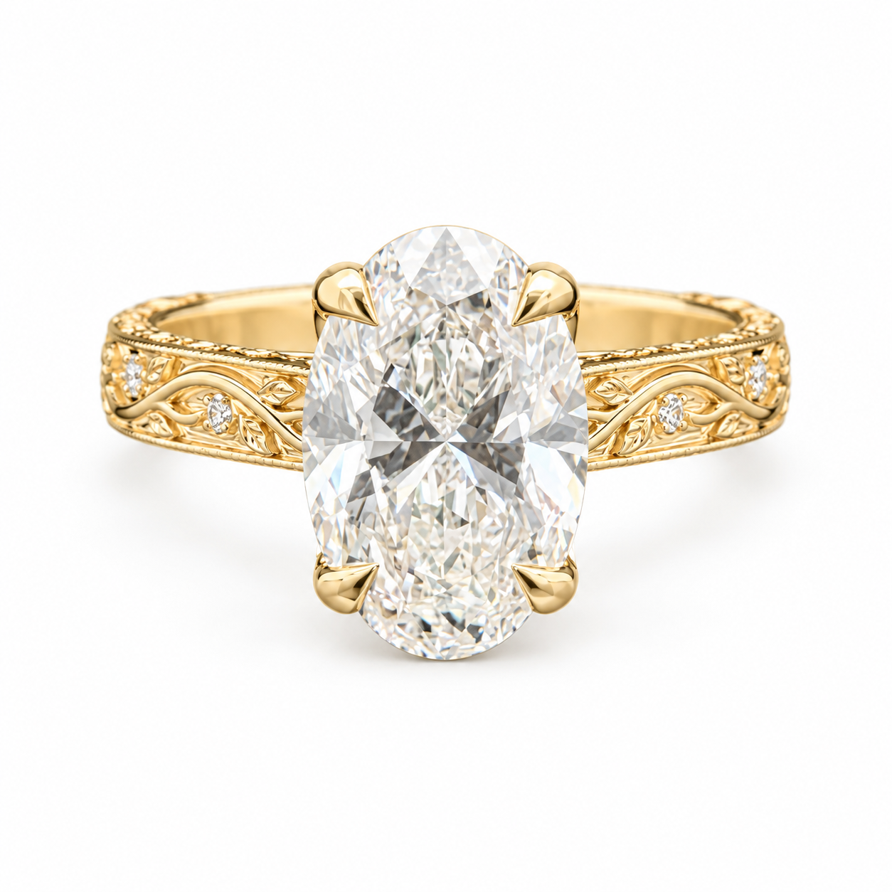 An oval-cut diamond engagement ring with a yellow gold band featuring intricate filigree detailing and small accent diamonds, set against a plain white background.