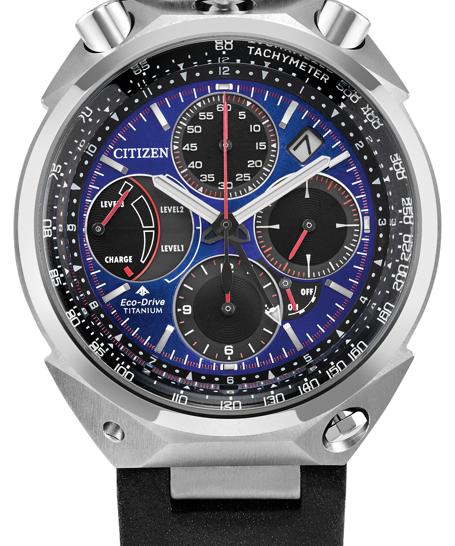 Citizen Eco-Drive Perpetual watch with a silver titanium case, blue and black dial, and a black perforated rubber strap.