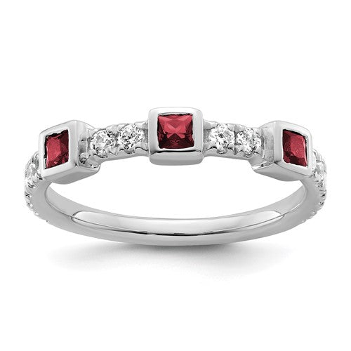 14K white gold ring with polished finish featuring diamonds and rubies, crafted by Solomon Jewelers.