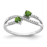 14k white gold two-stone peridot and diamond ring featuring a sleek band and elegant gemstone setting.