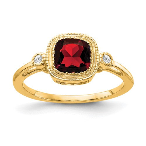 14k gold cushion garnet and diamond ring featuring a large central gemstone and sparkling accents, designed by Solomon Jewelers.