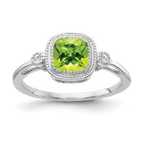 14k white gold cushion peridot and diamond ring with intricate detailing, elegant jewelry piece showcasing vibrant green gemstone.