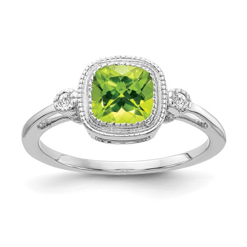 14k white gold cushion peridot and diamond ring with intricate detailing, elegant jewelry piece showcasing vibrant green gemstone.