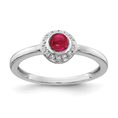 14k white gold ring with diamond accents and a cabochon ruby, showcasing elegant jewelry craftsmanship.