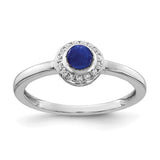 14k white gold ring featuring a diamond and cabochon sapphire, showcasing elegant jewelry design with sparkling gemstones.