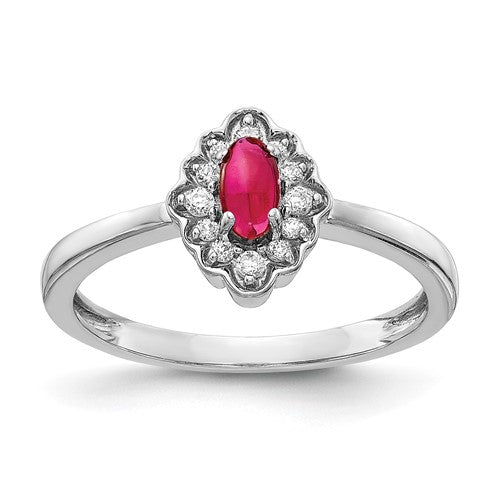 14k white gold ring featuring a diamond accent and oval cabochon ruby, designed by Solomon Jewelers.