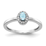 14k white gold ring featuring a large oval cabochon aquamarine and diamond accents, elegant jewelry piece from Solomon Jewelers
