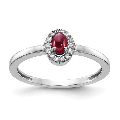 14k white gold diamond and oval cabochon garnet ring, showcasing a sparkling gemstone on a sleek jewelry ring.