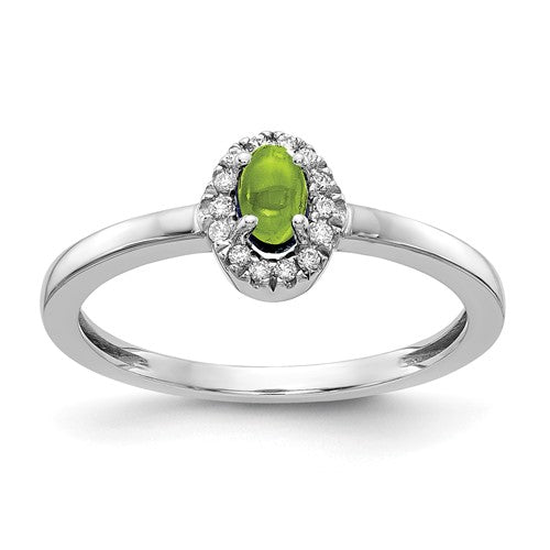 14k white gold ring with a large oval cabochon peridot and sparkling diamonds, featuring intricate Solomon Jewelers craftsmanship.