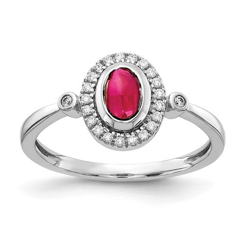 14k white gold diamond and oval cabochon ruby halo ring with sparkling diamonds and vibrant ruby centerpiece.