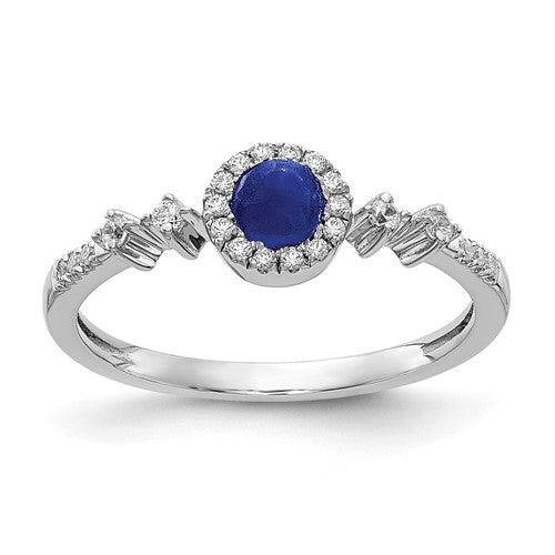 14k white gold diamond and cabochon sapphire halo ring, featuring sparkling diamonds and deep blue sapphire centerpiece.