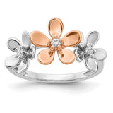 14k rose and white gold diamond flower ring showing a detailed close-up of the floral design and sparkling diamonds.