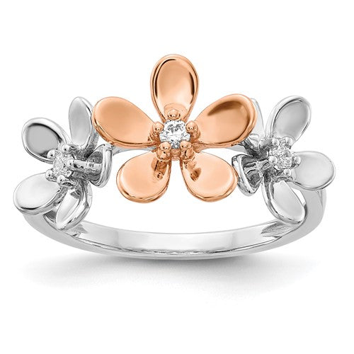 14k rose and white gold diamond flower ring showing a detailed close-up of the floral design and sparkling diamonds.