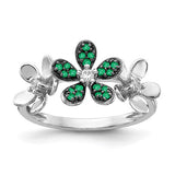 14k white gold flower ring with diamonds and emeralds, featuring intricate gemstone detailing and elegant craftsmanship.