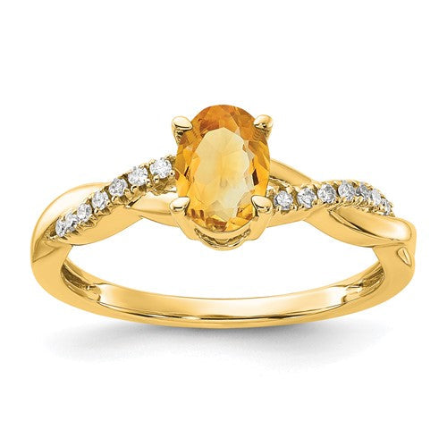 14K gold oval citrine and diamond ring showcasing a vibrant yellow gemstone and sparkling diamonds in a elegant jewelry setting