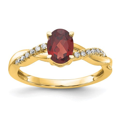 14K gold oval garnet and diamond ring showcasing a vibrant red garnet centerpiece with sparkling diamonds in a Solomon Jewelers design