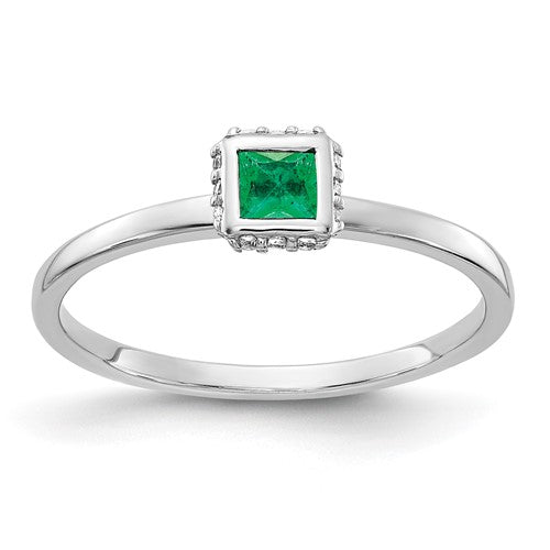 14k white gold diamond and princess emerald ring showcasing a sparkling emerald centerpiece and brilliant diamond accents.