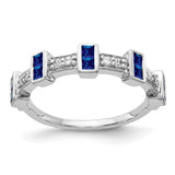 14k white gold ring featuring fancy diamonds and sapphires, showcasing elegant jewelry design with sparkling stones.