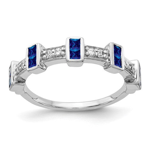 14k white gold ring featuring fancy diamonds and sapphires, showcasing elegant jewelry design with sparkling stones.