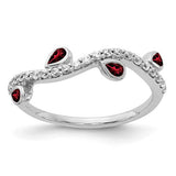 14k white gold ring featuring diamonds and pear-shaped garnets in a curved design, crafted by Solomon Jewelers.