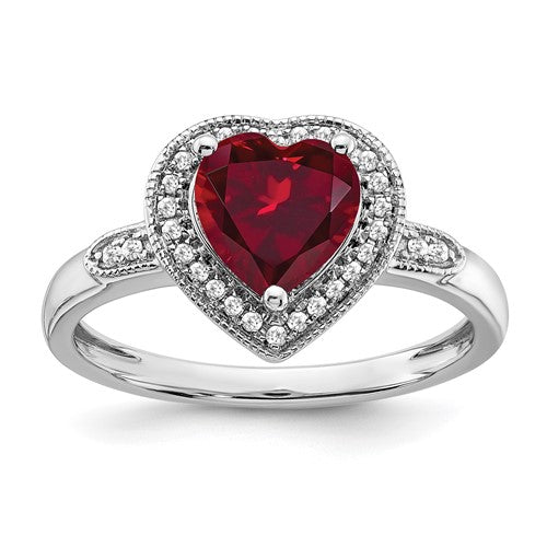 14k white gold heart-shaped ruby and diamond halo ring, elegant jewelry piece with sparkling stones and intricate design.