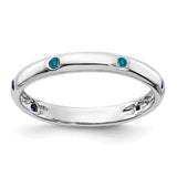 14k white gold ring with six blue diamonds, elegant jewelry band featuring sparkling gemstone accents.