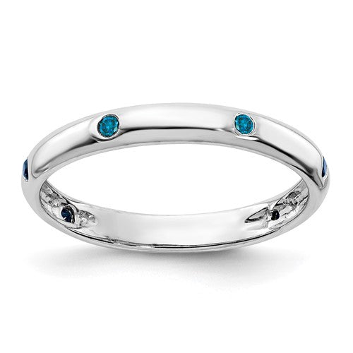 14k white gold ring with six blue diamonds, elegant jewelry band featuring sparkling gemstone accents.