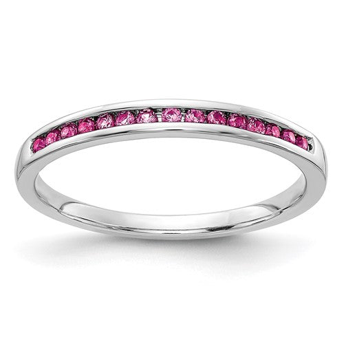 14k white gold pink sapphire channel ring featuring a row of sparkling pink sapphires in a sleek jewelry design.