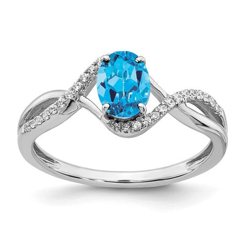 14k white gold oval blue topaz and diamond twist ring with intricate design, jewelry ring featuring blue gemstone and sparkling diamonds.