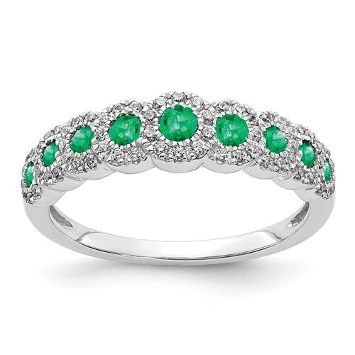 14k white gold diamond and emerald polished ring, showcasing intricate design and sparkling gemstones.