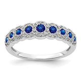 14k white gold ring with diamonds and sapphires, polished jewelry ring showcasing elegant gemstone details.